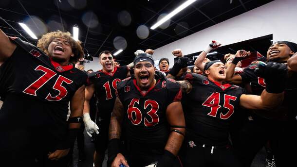 San Diego State University football players celebrate in this undated photo.