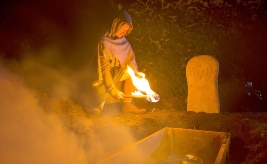 Dramatic re-enactment: Saxon/early medieval man finds the “vampire’s” body in tact with blood on the shroud at the mouth.