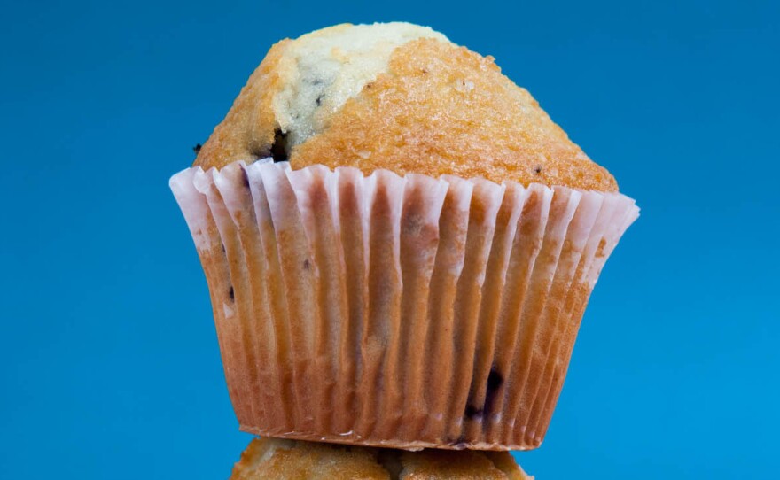 These two muffins each contain 35 grams (about 8 teaspoons) of sugar. Add in a cup of sweetened blueberry Greek yogurt (18 grams, or about 4 teaspoons, of sugar) and you've got 22 teaspoons of sugar – the amount many Americans eat per day. Under the new Dietary Guidelines, we should eat no more than 10 percent of daily calories from sugar. On a 2,000-calorie daily diet, that's about 12 teaspoons.