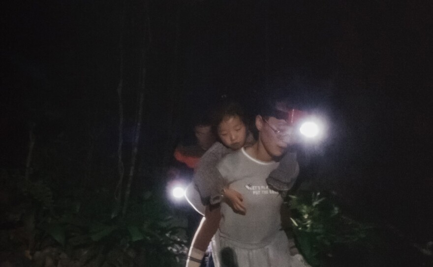 The Roh family trek through the jungle.
