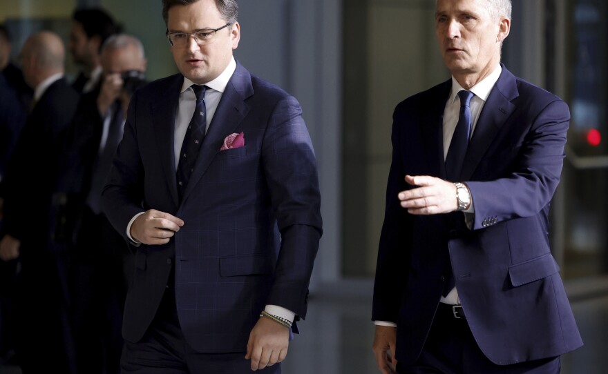 Ukraine's Foreign Minister Dmytro Kuleba, left, walks with NATO Secretary General Jens Stoltenberg as they arrive for a meeting of NATO foreign ministers at NATO headquarters in Brussels on Thursday.