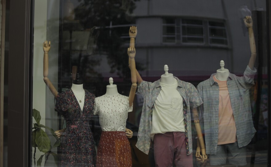 Mannequins in a clothing shop are posed to show solidarity with the Black Lives Matter movement in Washington, D.C., on June 19, 2020. The city was marking Juneteenth, the holiday celebrating the day in 1865 that enslaved Black people in Galveston, Texas, learned they had been freed from bondage, more than two years after the Emancipation Proclamation. Juneteenth is now a federal holiday.
