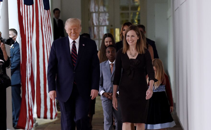 President Trump and Judge Amy Coney Barrett walk to the Rose Garden of the White House on Saturday.