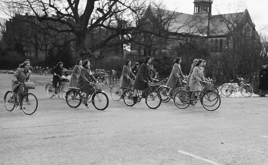 Wellesley College students bike across campus in 1942. The school now accepts applications from trans women, but not trans men, and only certain nonbinary people.