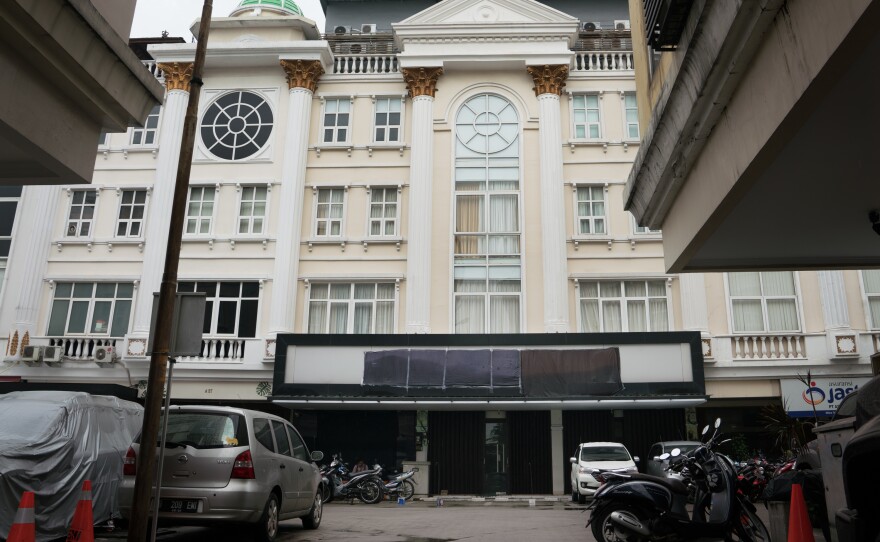 The front of the Hizb ut-Tahrir headquarters in Jakarta has a blacked-out sign. The Islamic organization favors a global caliphate and was banned in July by the government, which deemed it a threat to national unity.