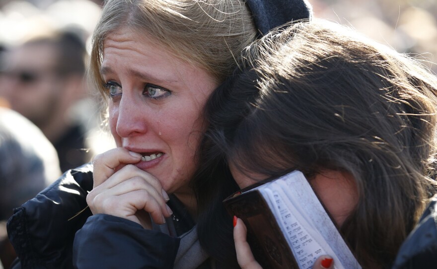 Mourners in Jerusalem cry during the funeral of four Jews killed in an attack on a kosher supermarket in Paris last week.