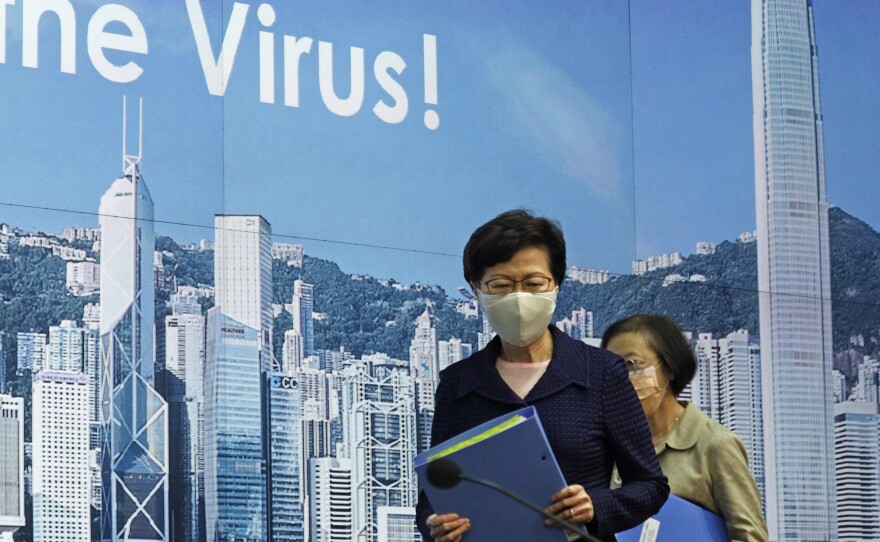 Hong Kong Chief Executive Carrie Lam, shown here arriving for a news conference in Hong Kong on Friday, is delaying the region's legislative elections by a year.