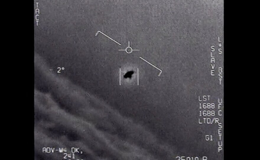 In this image from 2015 video provided by the Department of Defense, an unexplained object is seen as it is tracked soaring high along the clouds, traveling against the wind.