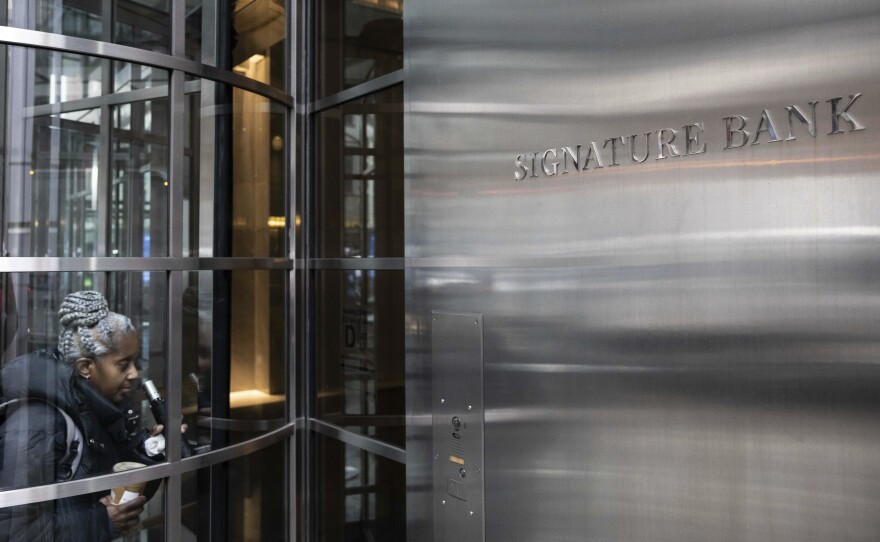 A person enters the Signature Bank headquarters in New York on March 13.