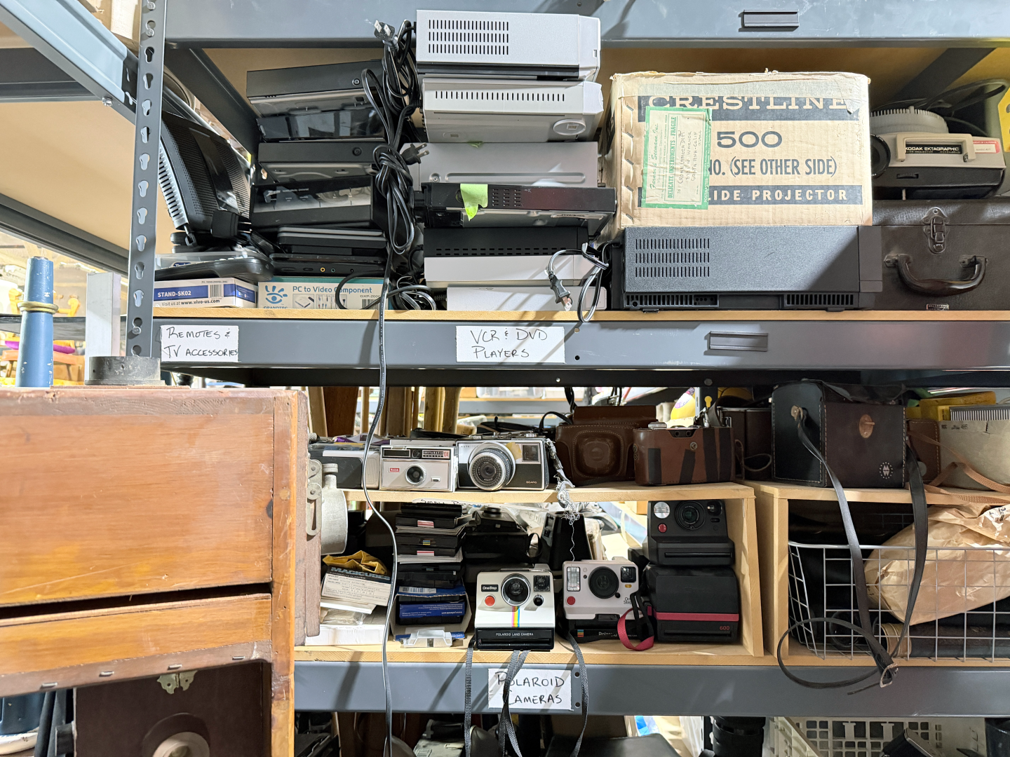 Cameras, VCR and DVD players, remotes and other television accessories are stored in the props warehouse at La Jolla Playhouse, March 23, 2026.