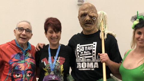 Troma founder and president Lloyd Kaufman with KPBS arts reporter Beth Accomando, Toxie, and Kristy Rose. July 25, 2025