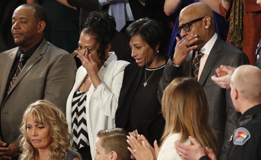 Robert Mickens (from top left), Elizabeth Alvarado, Evelyn Rodriguez, Freddy Cuevas, parents of two Long Island teenagers who were believed to have been killed by MS-13 gang members, during Trump's speech.