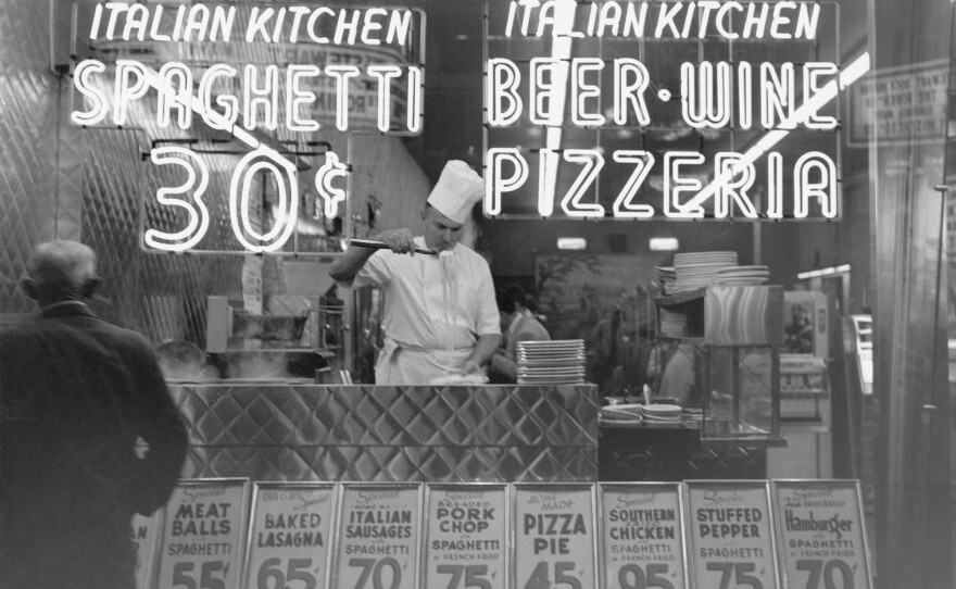 A chef cooks spaghetti at an Italian restaurant in Manhattan in 1953. In the late 19th and early 20th century, social workers and nutritionists cautioned that Italian food was too garlicky and spicy — which they said increased the craving for alcohol. It's now America's most popular "ethnic" cuisine.