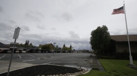 In this April 5, 2020, file photo shows an empty parking lot at Bethel Open Bible Church, which leases the building to the Cross Culture Christian Center, in Lodi, Calif. 