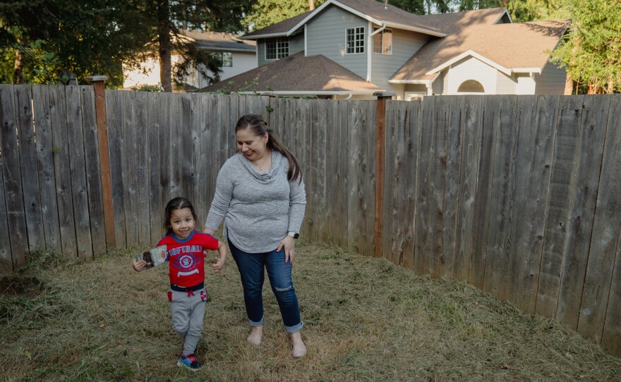 Lopez, right, plays with her son, Keivin Alfaro Lopez, 3.