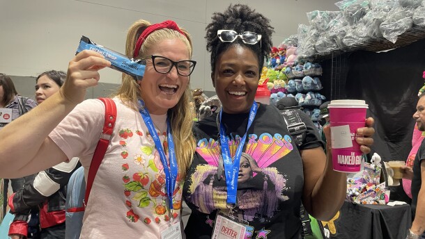 Sam Ginn and Melissa Coleman-Reed display their Comic-Con survival snacks: a protein bar for Ginn and coffee for Coleman-Reed in this undated photo.