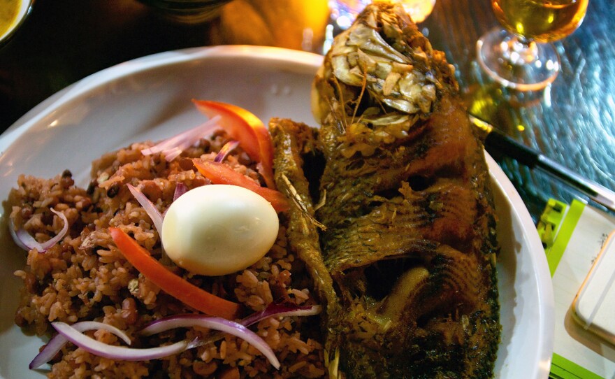 Fried tilapia with jollof rice, a West African specialty served at African Pot. The 3-year-old restaurant in Guangzhou, China, caters to the city's many African immigrants. Lately, it's seen a surge in Chinese customers, too.