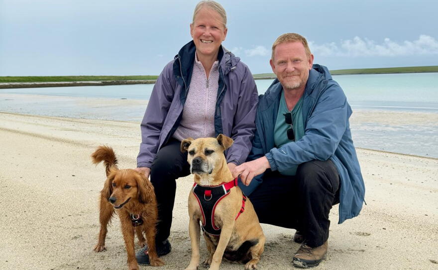 Susan Chinnery and Steve Lewis with their dogs Connie and Truffle on the island of Westray in Orkney.