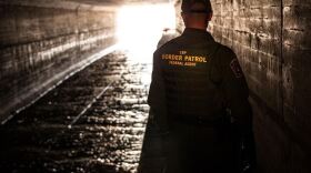 A Border Patrol agent inspecting a water drainage tunnel that spans from Nogales, Arizona into Mexico in this undated photo.