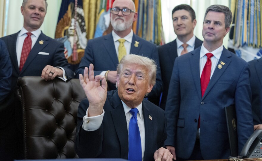 President Trump speaks in the Oval Office of the White House on Thursday in Washington.