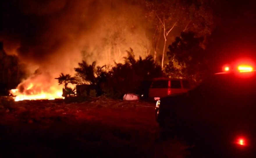A brush fire destroyed two vehicles and burned vegetation in the 2100 block of Esplendido Avenue in San Marcos, April 18, 2016.