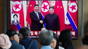 People watch a TV screen showing a file image of North Korean leader Kim Jong Un, right, and Chinese President Xi Jinping, at the Seoul Railway Station in Seoul, South Korea, Friday, June 5, 2026.
