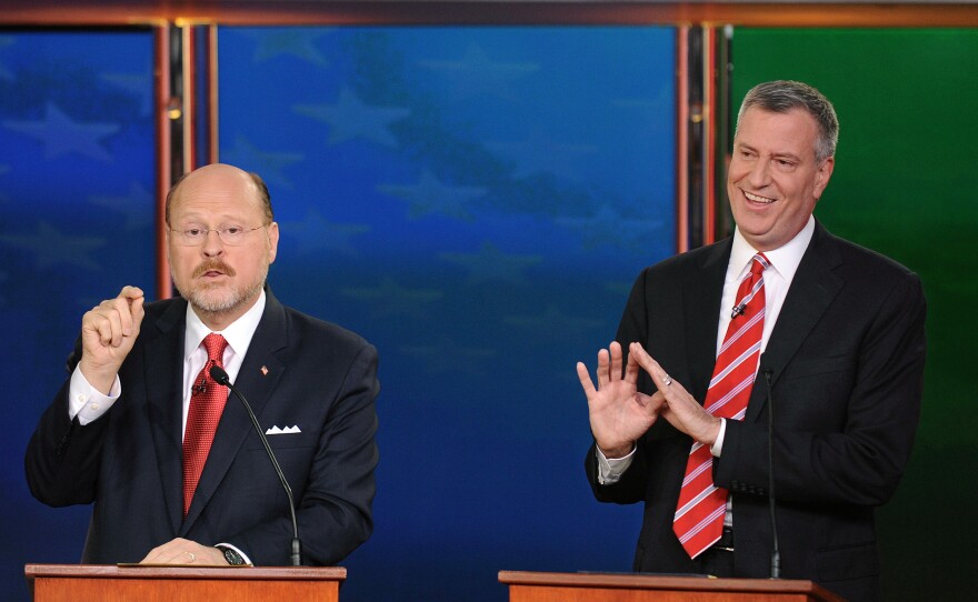 Republican Joe Lhota (left) makes a point during a debate with Bill de Blasio, his Democratic rival in the New York City mayor's race, on Oct. 30.