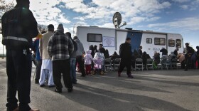 Victims of Superstorm Sandy wait in line to apply for recovery assistance at a FEMA processing center Friday in Coney Island. The agency has been congratulated for its response to the storm.