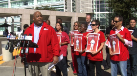Registered nurse Michael Jackson stands with other medical workers and representatives from a nurses union to voice concerns over UC San Diego Medical Center's lack of Ebola preparedness, October 28, 2014.