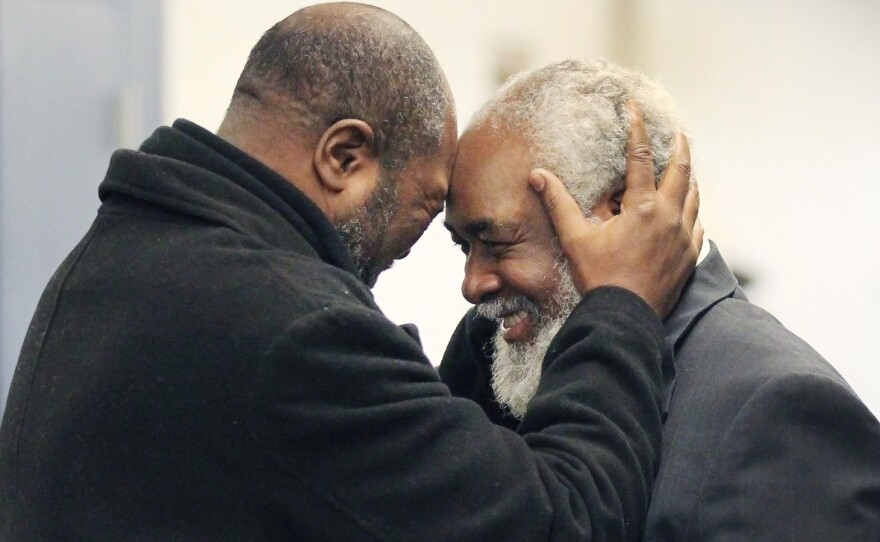 Kwame Ajamu, left, celebrates the release of his brother, Wiley Bridgeman, at a Cleveland courthouse. Bridgeman was convicted of a murder charge, along with Ajamu and Ricky Jackson, in 1975. They were found innocent of the crime when the witness recanted.