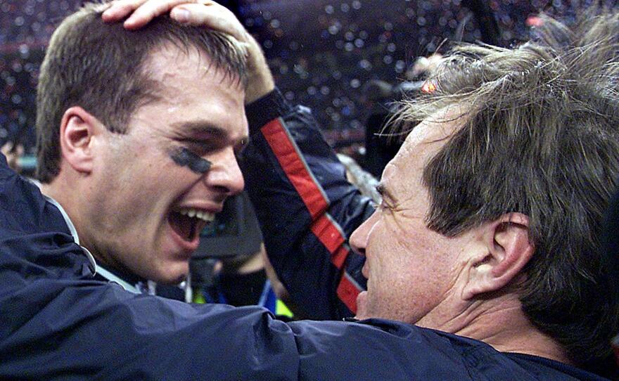 Brady and Patriots head coach Bill Belichick celebrate after Brady's first Super Bowl win, in February 2002. Brady and Belichick would win six Super Bowls together.