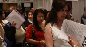 Job seekers wait in line to speak with job recruiters at a job fair for businesses in the medical field on May 8, 2009 in New York, New York. 