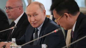 Russian President Vladimir Putin, center, looks at President of Xinhua News Agency Fu Hua, right, while speaking to representatives of international news agencies as General Director of the Russian news agency TASS, Andrey Kondrashov, left, sits near on the sidelines of the St. Petersburg International Economic Forum at the Constantine Palace in St. Petersburg, Russia, on Thursday, June 4, 2026.