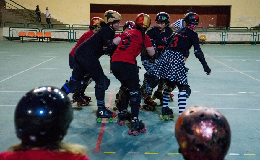 CaiRollers members play against each other on the handball courts of the Cairo International Stadium.