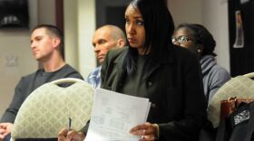 Sharmaine Moseley, center, attends Albany's Citizens' Police Review Board meeting on Oct. 11, 2012 at the GWU Center in Albany, N.Y. 