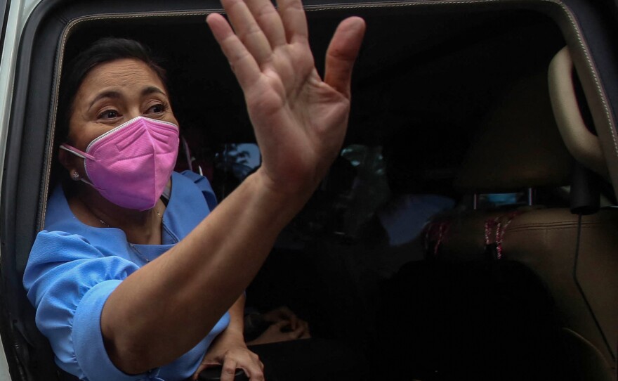 Philippine Vice President Leni Robredo gestures to a crowd of supporters in Manila on October 7, 2021, the day she filed her candidacy for the 2022 presidential race.