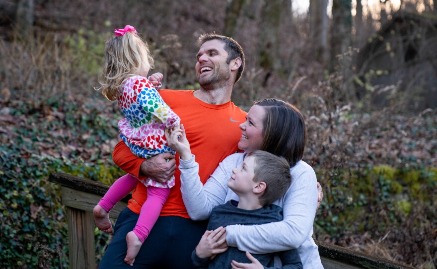 Blake Farmer with his wife Moriah Farmer, and two kids, Turner, 8, and Louisa, 2, in the backyard of their home in Nashville, Tennessee. After a family gathering over Thanksgiving, Louisa contracted COVID-19 after showing symptoms of coughing and sneezing. This resulted in breakthrough cases for the whole family, who navigated working remotely and having kids home from school for nearly two weeks.