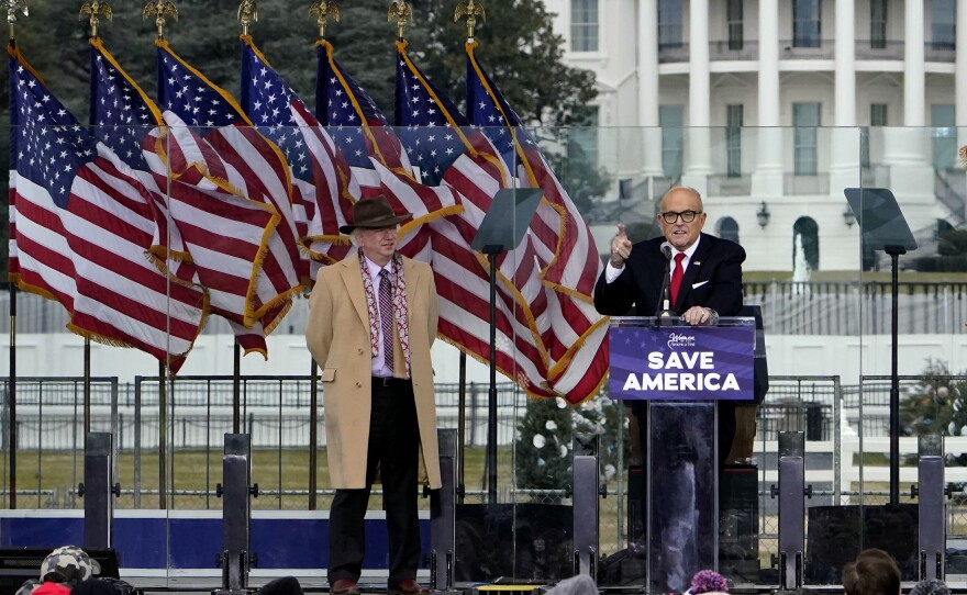 Lawyer John Eastman stands next to former New York Mayor Rudy Giuliani at the Jan. 6 rally in support of former President Donald Trump. Eastman has been subpoenaed to appear before the House panel investigating the riot that followed the rally.