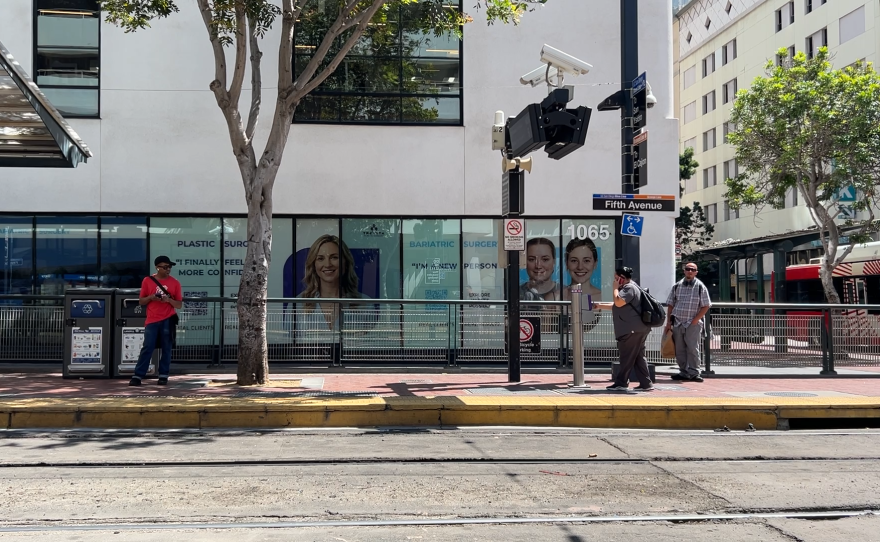 A rider taps to pay at the Fifth Avenue trolley station in downtown San Diego on Wednesday, May 6, 2026