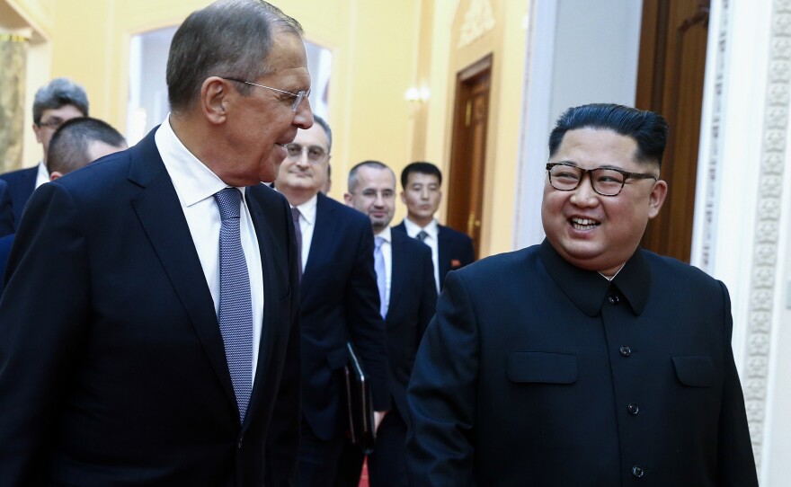 Russian Foreign Minister Sergey Lavrov walks with North Korean leader Kim Jong Un in Pyongyang during their meeting on Thursday.