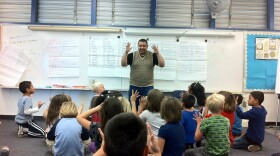 Spanish Teacher Juan Tirado works with first graders at McKinley Elementary, May 2, 2012. Language instruction is a requirement for authorized International Baccalaureate schools, which means IB principals have to find the money to pay for the additional teachers.