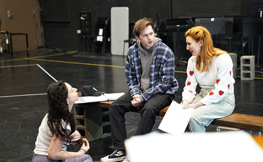 Director Danya Taymor speaks with cast members Brody Grant (Ponyboy) and Piper Patterson (Cherry) during rehearsal for "The Outsiders" in an undated photo at the La Jolla Playhouse.