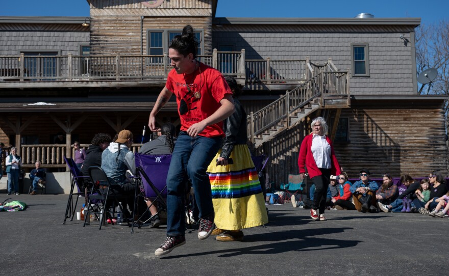 Sipayik resident Chris Sockeeson, center, who belongs to the Passamaquoddy tribe and of the Turning Eagle Drum Group, dances as the group plays in Millinocket, Maine.