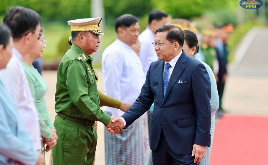 In this photo released by Myanmar President Office, Myanmar President Min Aung Hlaing, right, shakes hands with Commander-in-Chief Gen. Ye Win Oo, left, upon his departure to Vietnam, at the Naypyitaw international airport Friday, Sept. 4, 2026, in Naypyitaw, Myanmar.