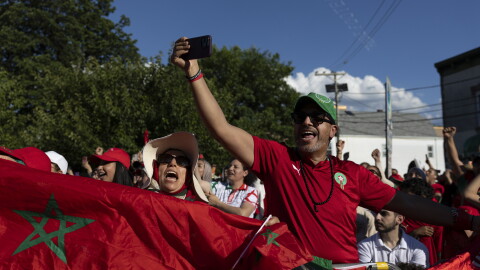 Supporters of Morocco wave flags and cheer during a watch party for the FIFA World Cup match against Brazil in Paterson, N.J. on June 13.