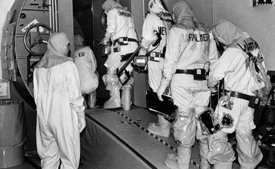Technicians at the Three Mile Island plant enter the outer airlock door leading into the containment building housing of the disabled nuclear reactor in Harrisburg, Pa., on Feb. 11, 1982.