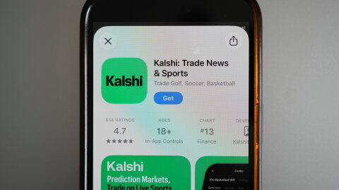 FILE - An ad for the prediction market app Kalshi is displayed on a mobile phone on April 16, 2026, in Chicago. (AP Photo/Erin Hooley, File)