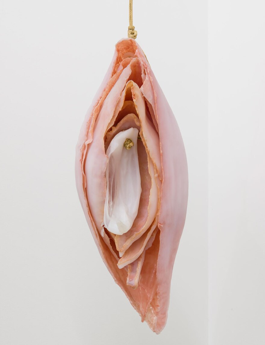 Kelly Akashi's "Eat Me" is a 2016 work of bronze, rope, silicone, pigment, glass and steel, modeled after a dehydrated onion.