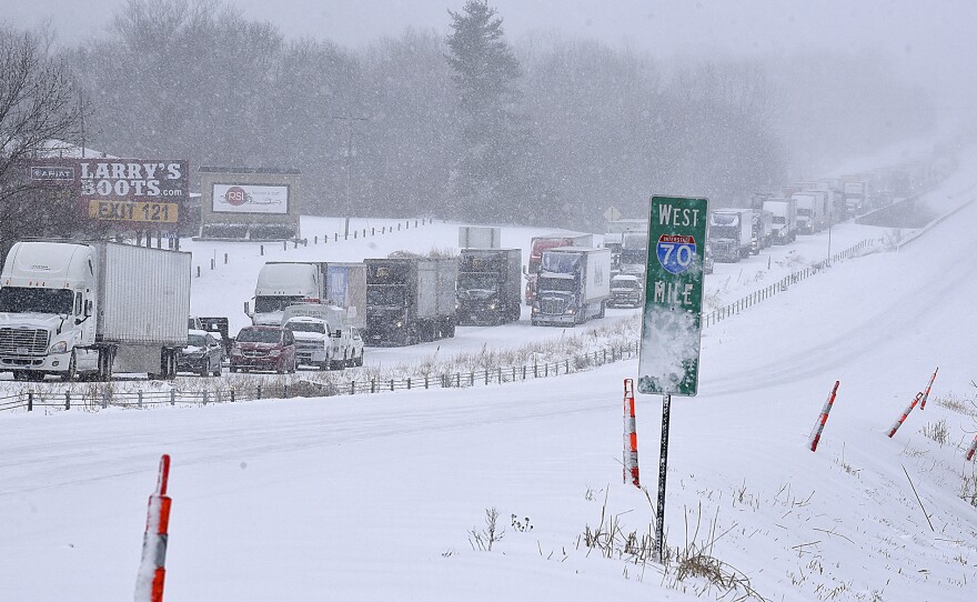 Traffic along eastbound Interstate 70 is halted on Wednesday in Columbia, Mo., following several accidents after a winter storm dumped several inches of snow.