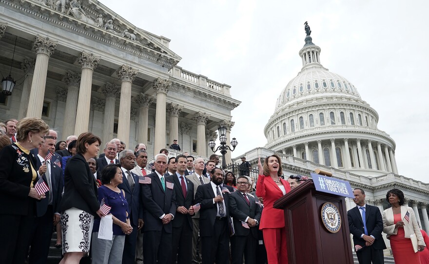 House Minority Leader Nancy Pelosi, D-Calif., is joined by House Democrats at a news conference in front of the U.S. Capitol on June 20 in Washington, D.C.